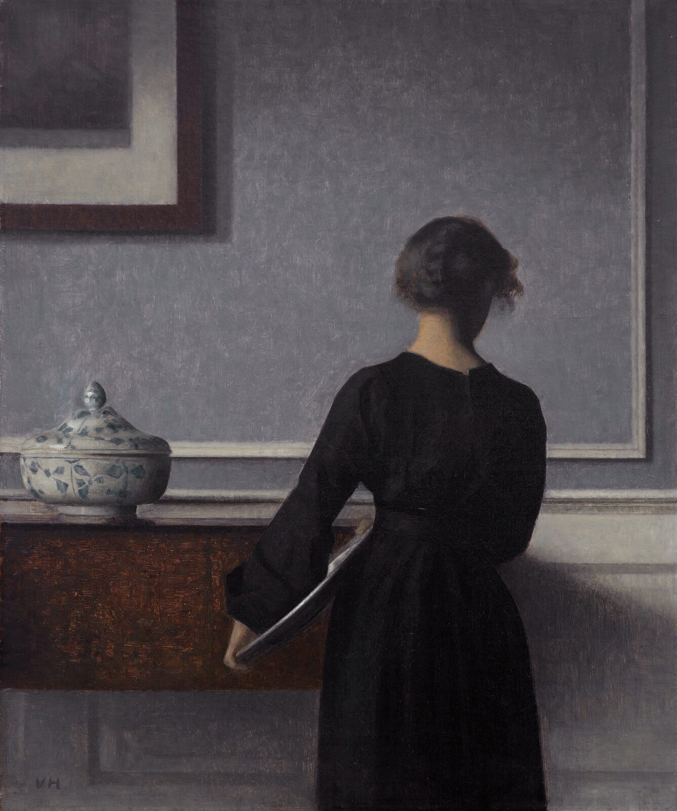 Wnętrze z młodą kobietą widzianą od tyłu - Vilhelm Hammershøi